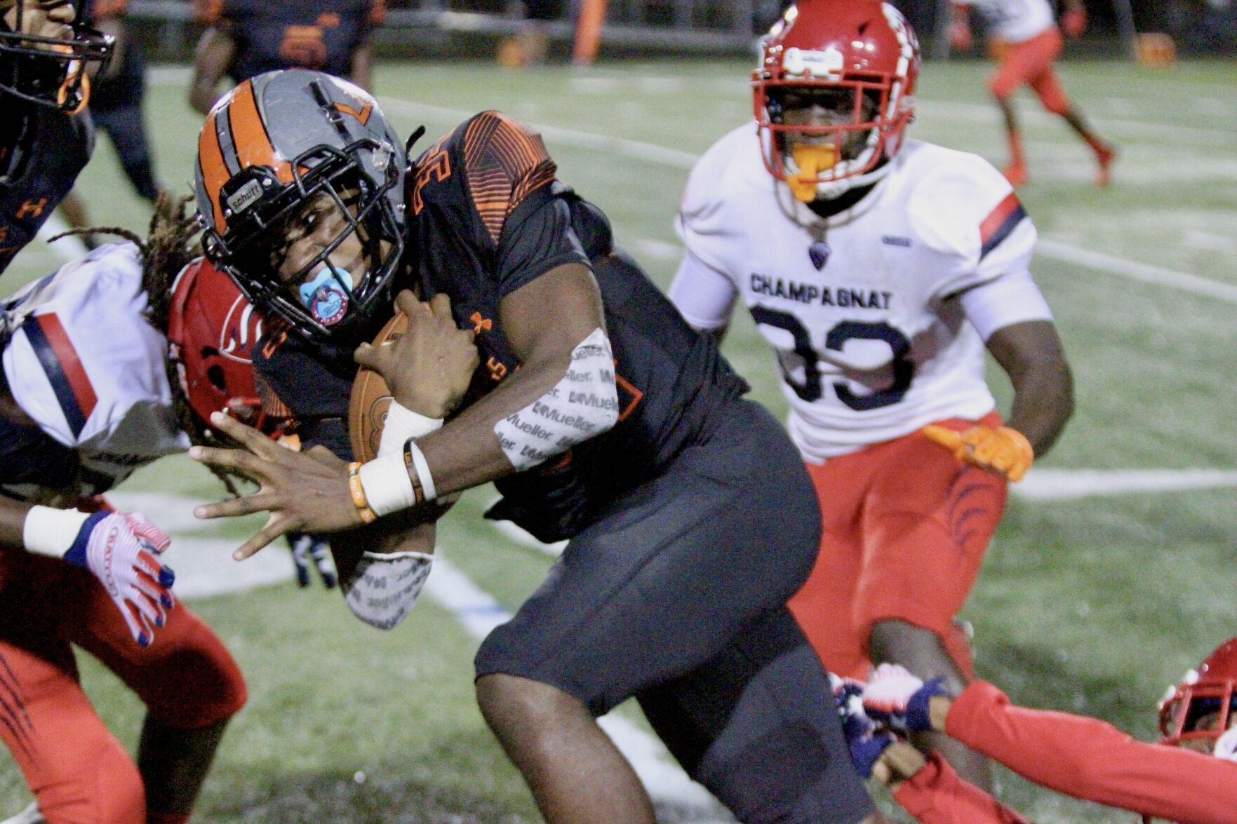 Lely Dukes2. Hard-running Guerschom Guerrier battles for some of his 121 yards rushing.jpeg